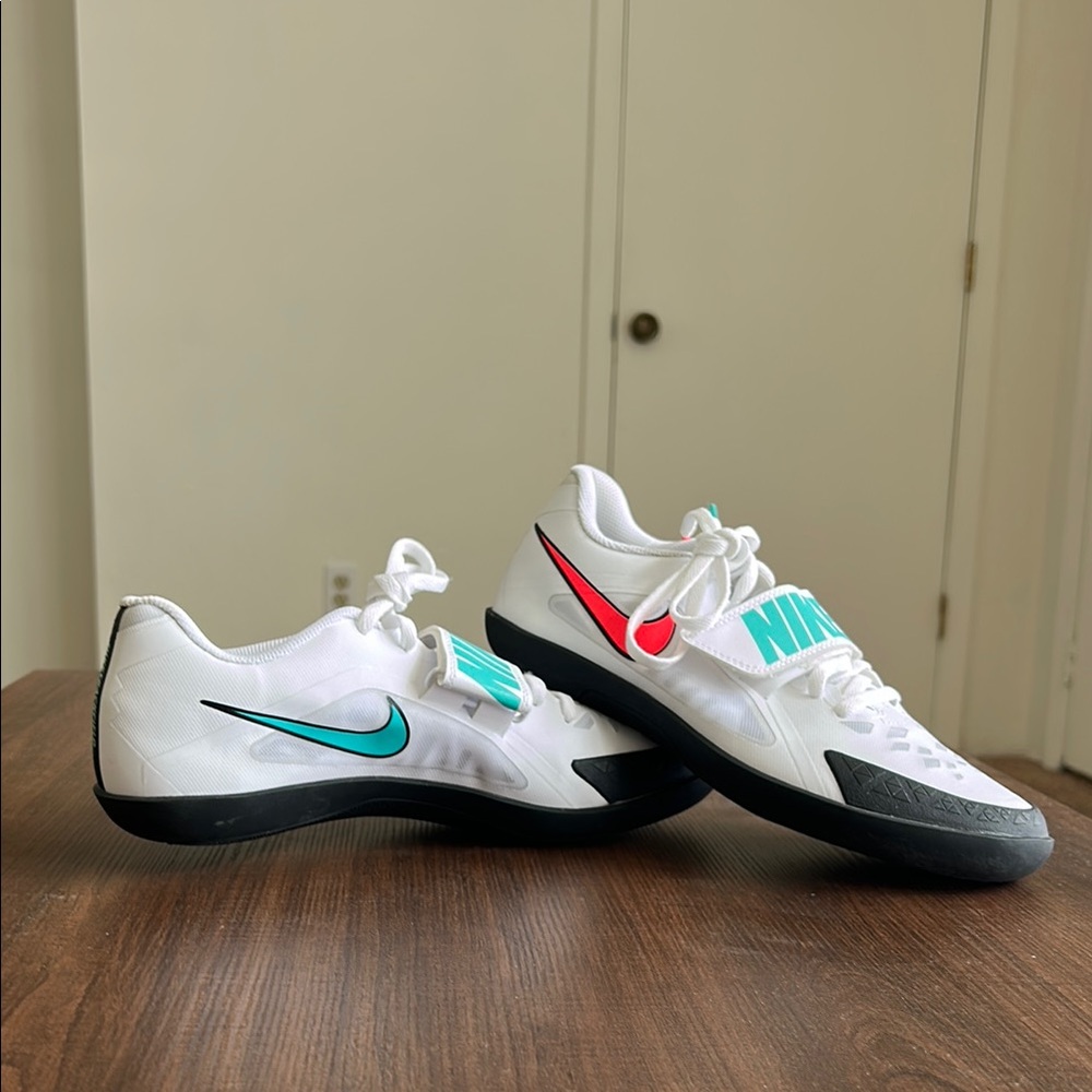 Nike White Throwing Shoes with Black, Teal, and Red Accents